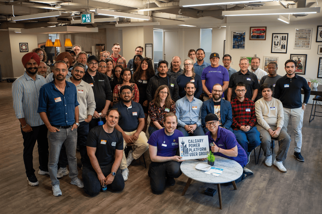 Calgary Power Platform User Group (CPPUG) End of Year Networking Event 2025 Group Photo featuring David He and Ryley Bauer of Bauer Automate